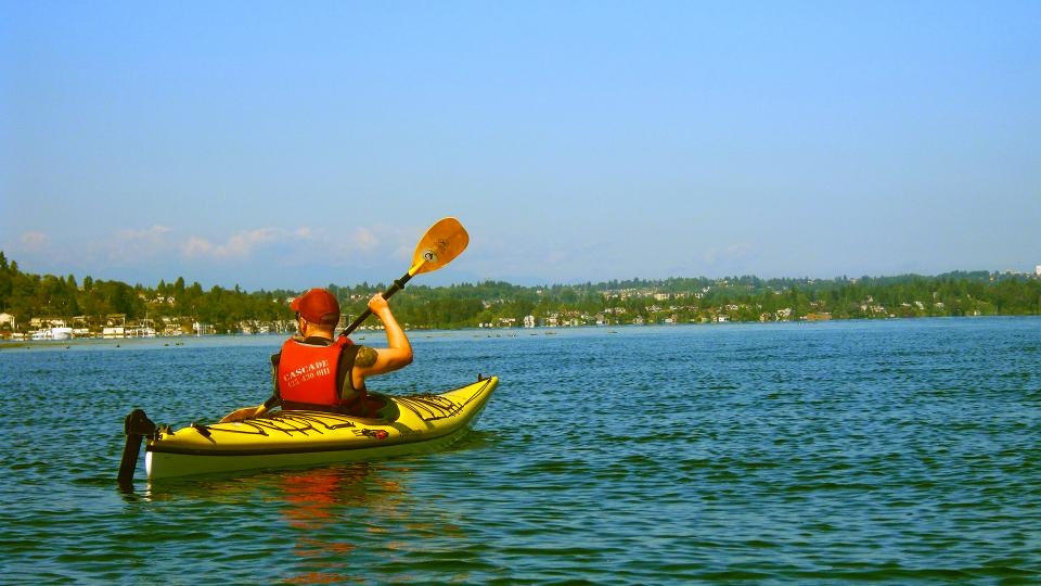 A yellow kayak on calm water